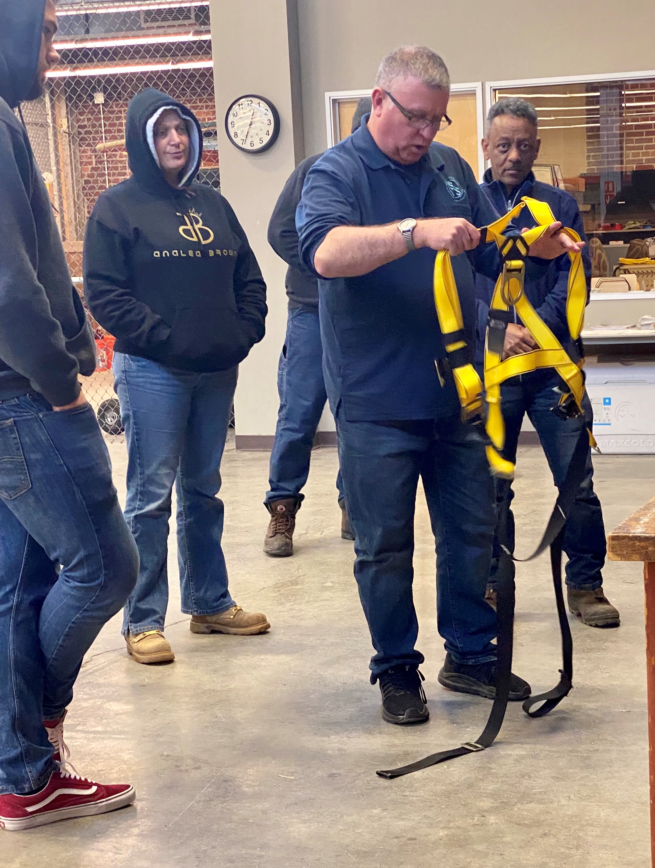 Pre-Apprenticeship and Construction Education (PACE) Instructor Ron Schuetz teaches students appropriate construction equipment. (Photo courtesy of Terumi Capeling, University of Washington, Western Region Universities Consortium).